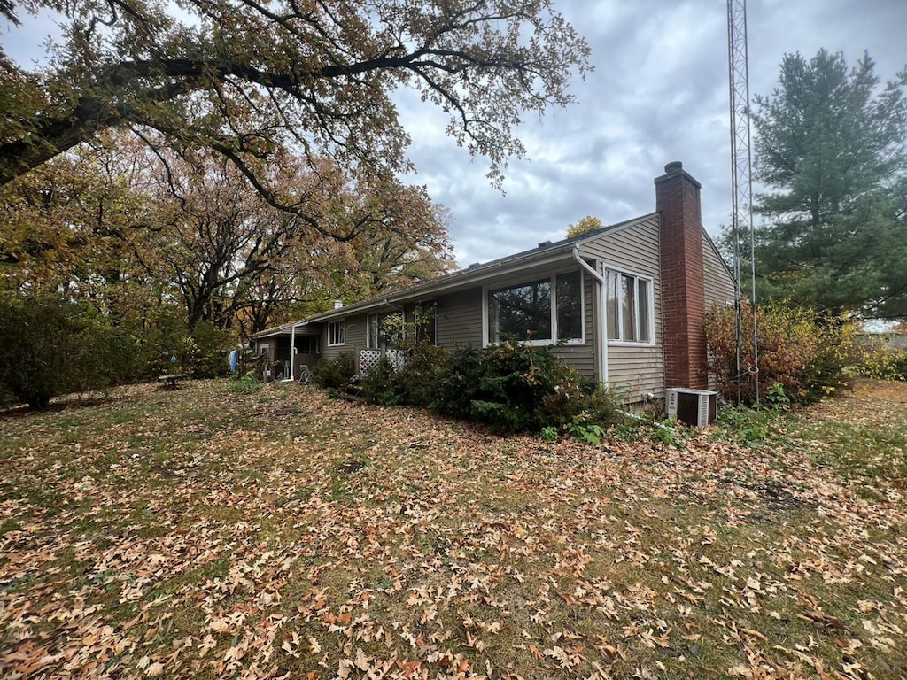 view of home's exterior with central air condition unit