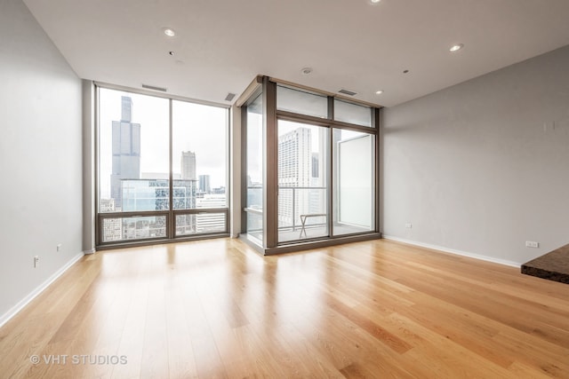 empty room featuring floor to ceiling windows and a wealth of natural light