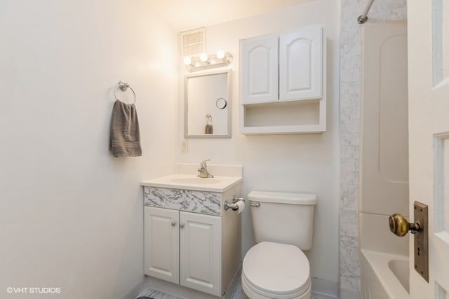 full bathroom featuring shower / bathing tub combination, vanity, and toilet