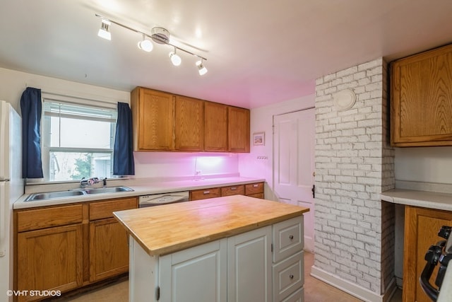 kitchen featuring wooden counters, a center island, dishwasher, sink, and black stove