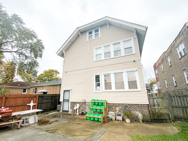 rear view of house featuring a patio