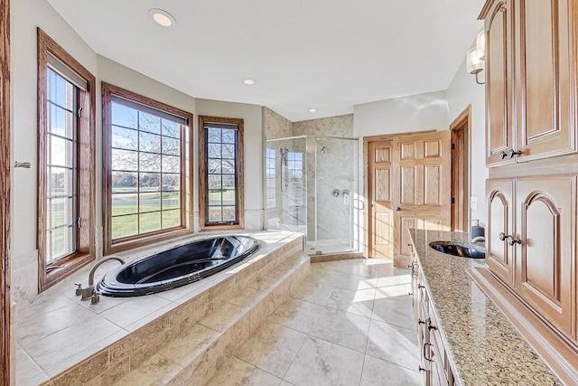 bathroom featuring vanity, shower with separate bathtub, and tile patterned floors