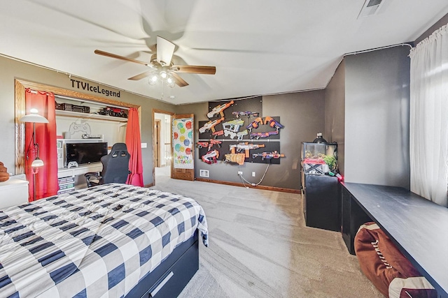 bedroom featuring light colored carpet, ceiling fan, and a closet