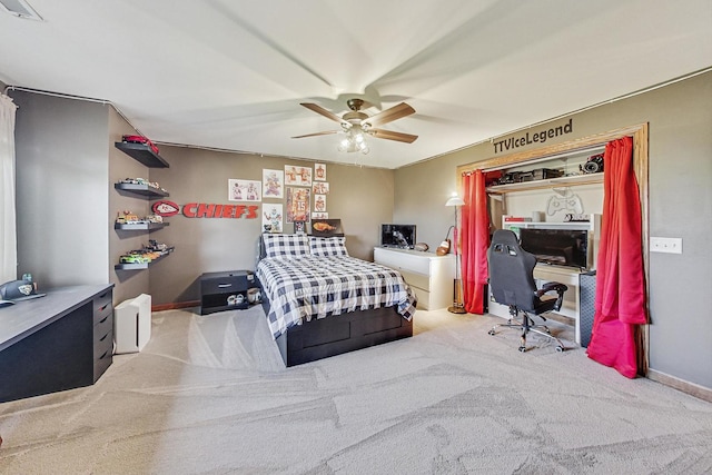 carpeted bedroom with ceiling fan