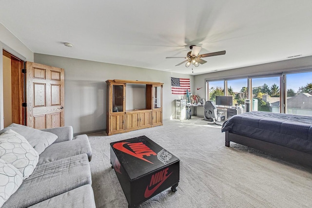 carpeted bedroom featuring ceiling fan