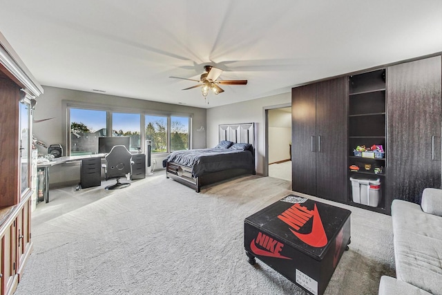 bedroom featuring light colored carpet and ceiling fan