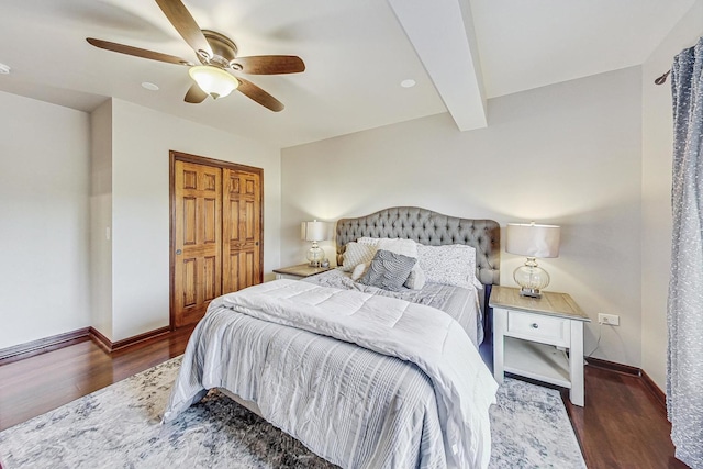 bedroom with dark hardwood / wood-style flooring, ceiling fan, and beam ceiling