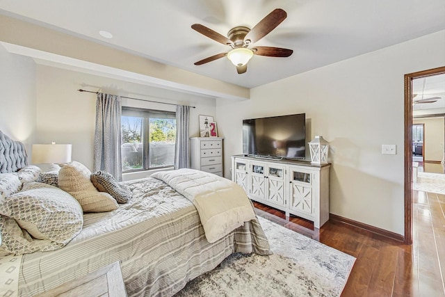 bedroom with dark wood-type flooring and ceiling fan