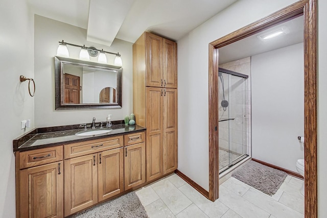 bathroom with walk in shower, vanity, and toilet