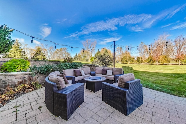 view of patio / terrace with an outdoor living space with a fire pit