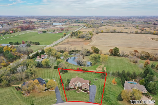 aerial view with a water view and a rural view