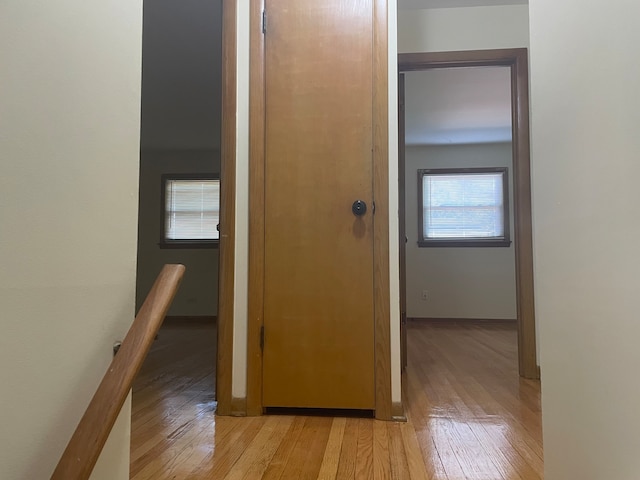 hall with light hardwood / wood-style flooring