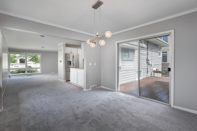 carpeted empty room featuring crown molding