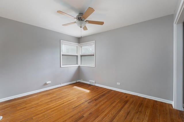 unfurnished room with hardwood / wood-style flooring and ceiling fan