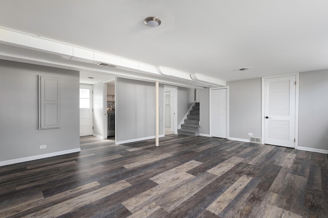 basement featuring dark hardwood / wood-style flooring