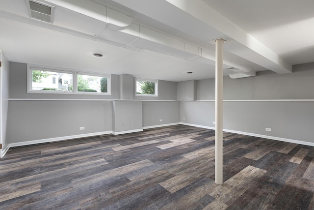 basement featuring dark hardwood / wood-style flooring