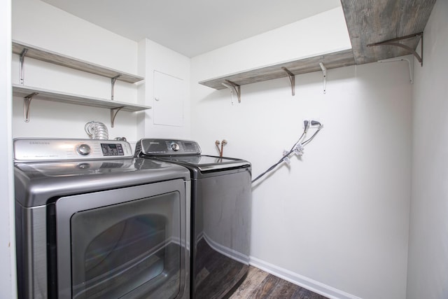 washroom with independent washer and dryer and dark hardwood / wood-style flooring