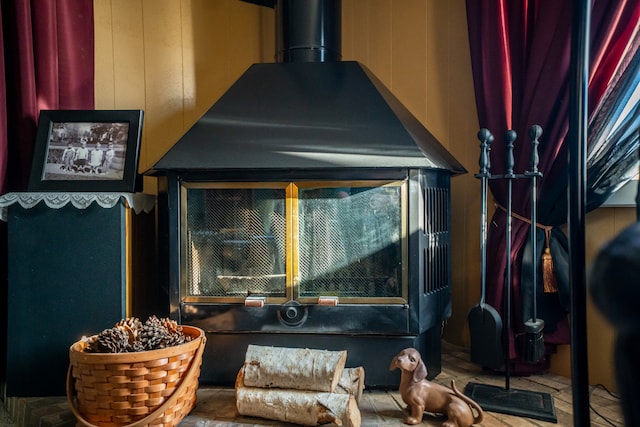 room details with wood walls and a wood stove