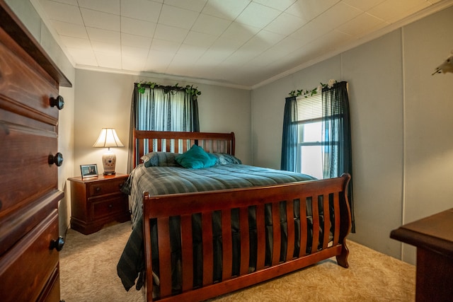 carpeted bedroom featuring ornamental molding