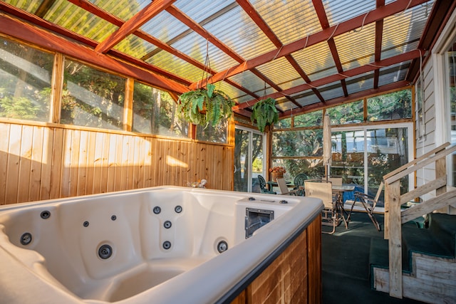 unfurnished sunroom featuring lofted ceiling