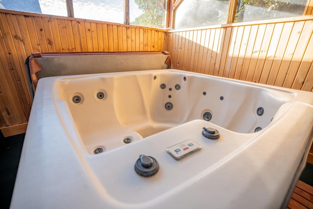 4140 E German Valley Rd, Freeport, IL 61032 - bathroom featuring a jetted tub and wooden walls