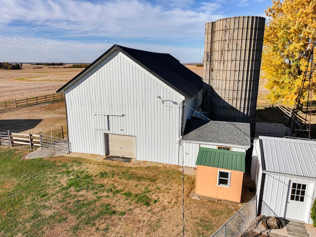 view of outbuilding featuring a rural view