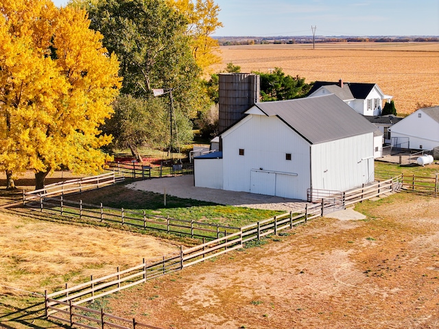 exterior space featuring an outdoor structure and a rural view