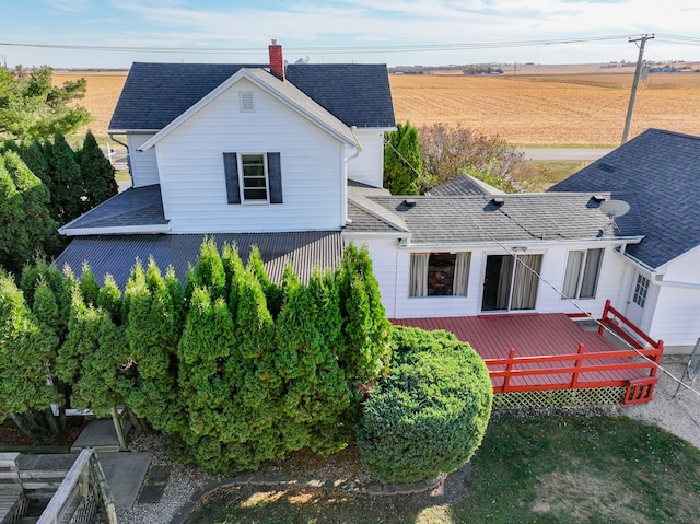 back of property with a wooden deck