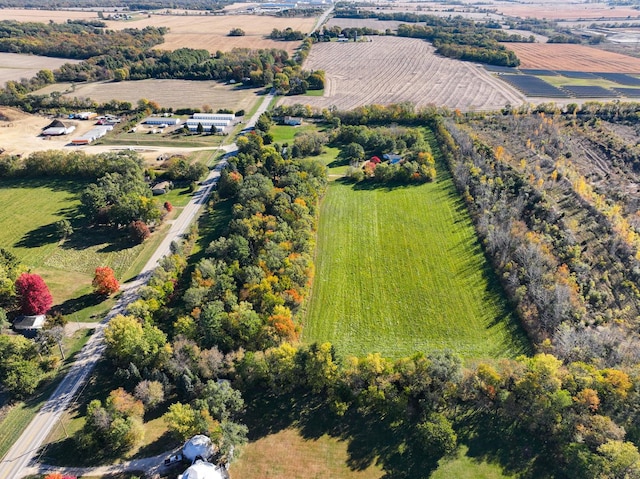 birds eye view of property with a rural view