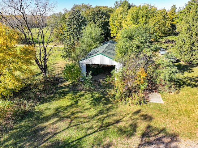 view of outbuilding with a lawn