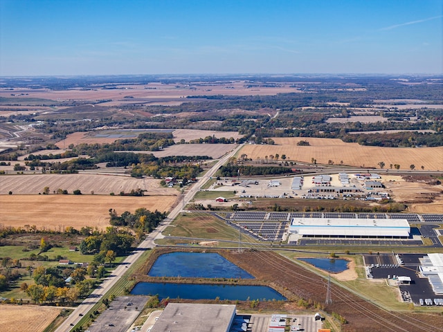 drone / aerial view featuring a rural view and a water view