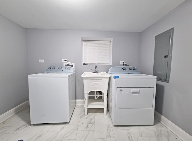 laundry room featuring washer and dryer and electric panel