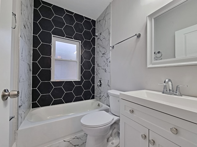 full bathroom featuring vanity, tiled shower / bath combo, and toilet