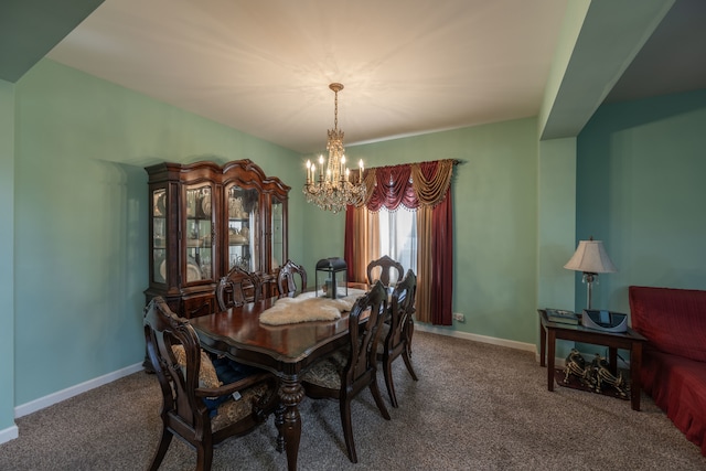 dining space featuring carpet floors and a chandelier