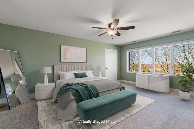 carpeted bedroom with ceiling fan