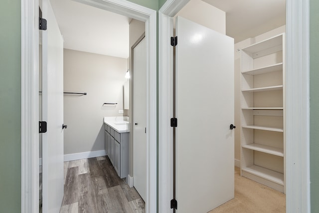 bathroom featuring hardwood / wood-style floors and vanity