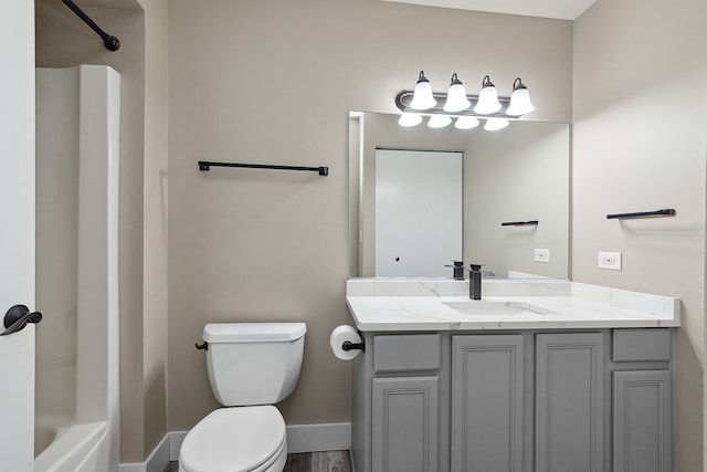 full bathroom with toilet, vanity, hardwood / wood-style flooring, and shower / bathtub combination