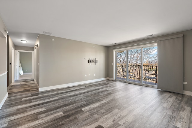 empty room featuring dark wood-type flooring