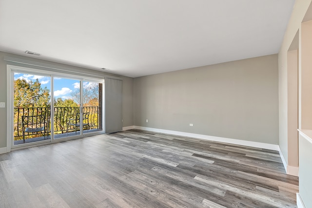 spare room with light hardwood / wood-style floors