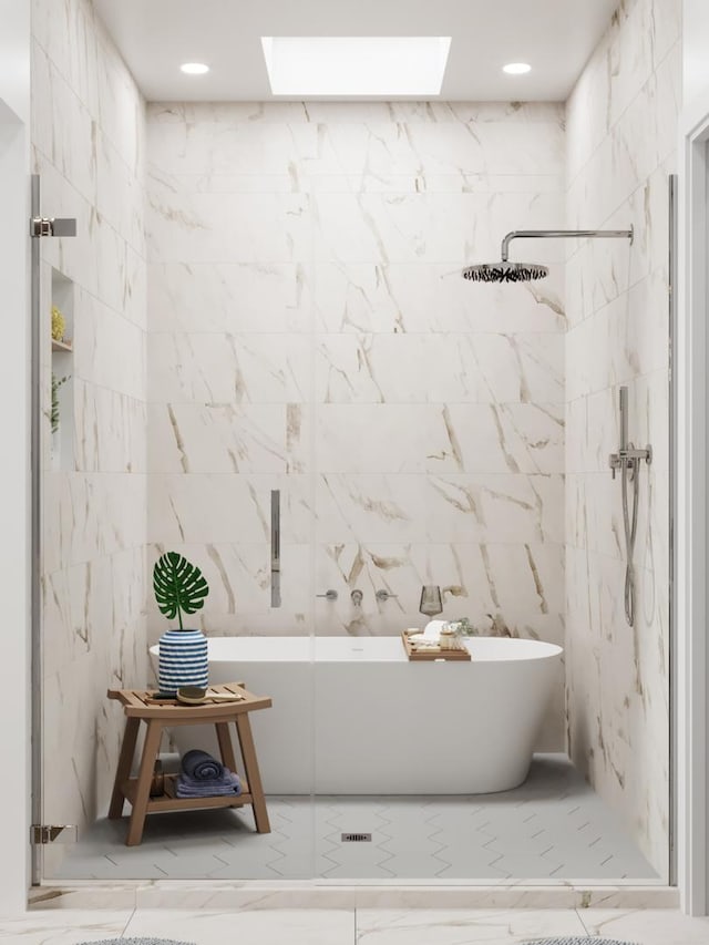 bathroom featuring shower with separate bathtub, a skylight, and tile walls