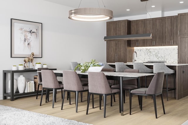 dining space with light wood-type flooring