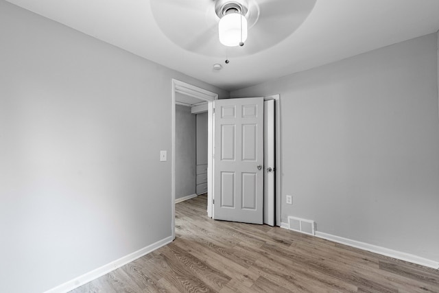 unfurnished bedroom with light hardwood / wood-style floors and ceiling fan