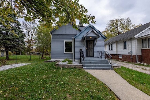 bungalow with a front lawn