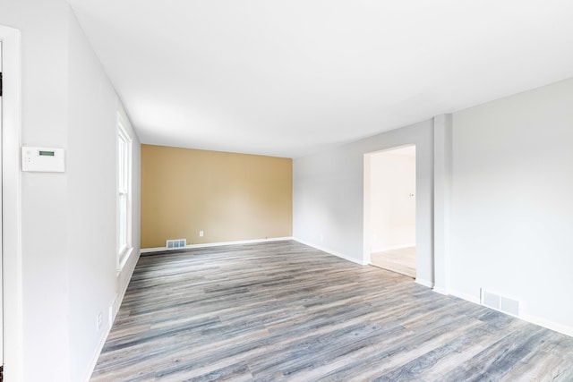 spare room with wood-type flooring