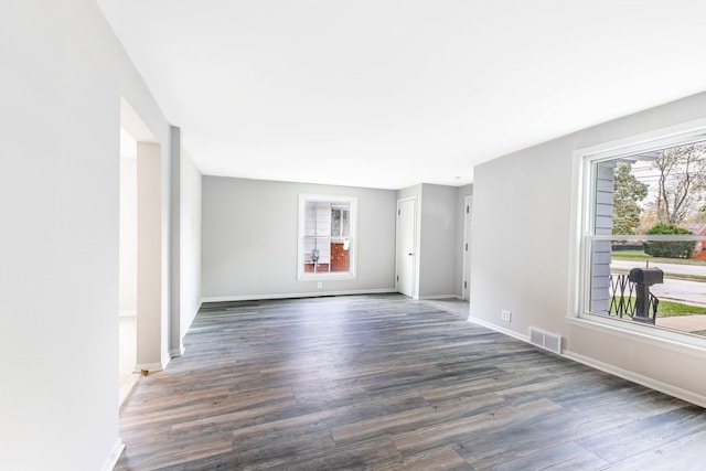 empty room with dark wood-type flooring