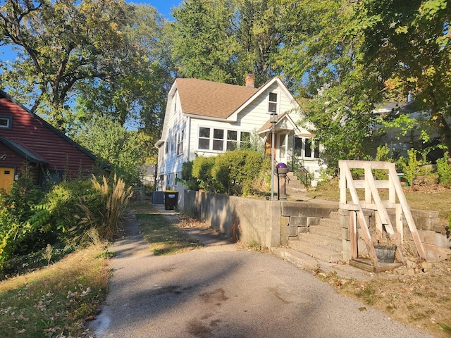 view of front facade with a chimney