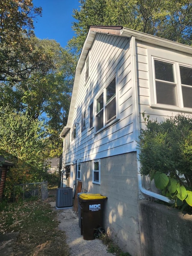 view of side of property with central AC unit