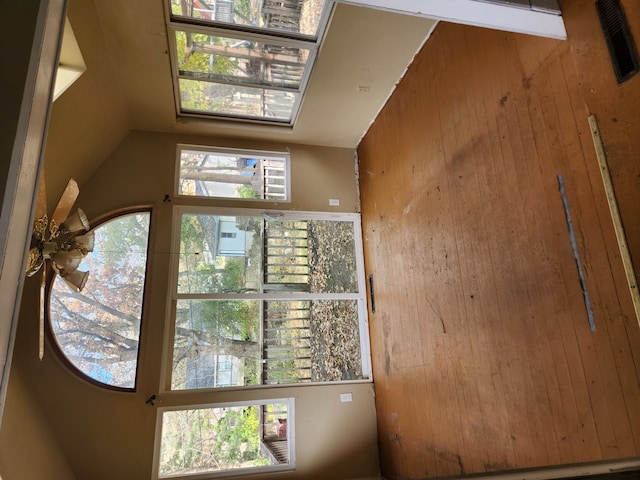 entryway featuring wood walls