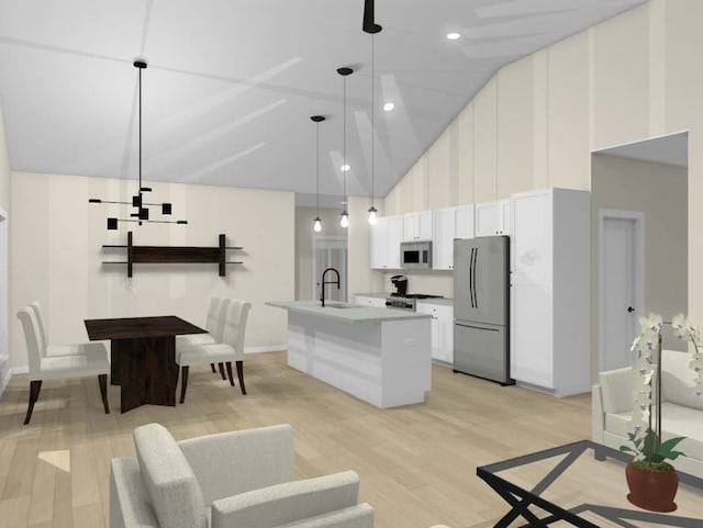 kitchen with a kitchen island with sink, decorative light fixtures, light wood-type flooring, white cabinetry, and appliances with stainless steel finishes