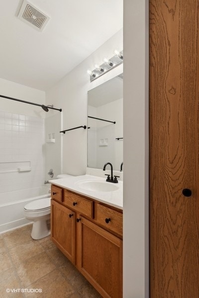 full bathroom featuring vanity, toilet, and shower / bathing tub combination